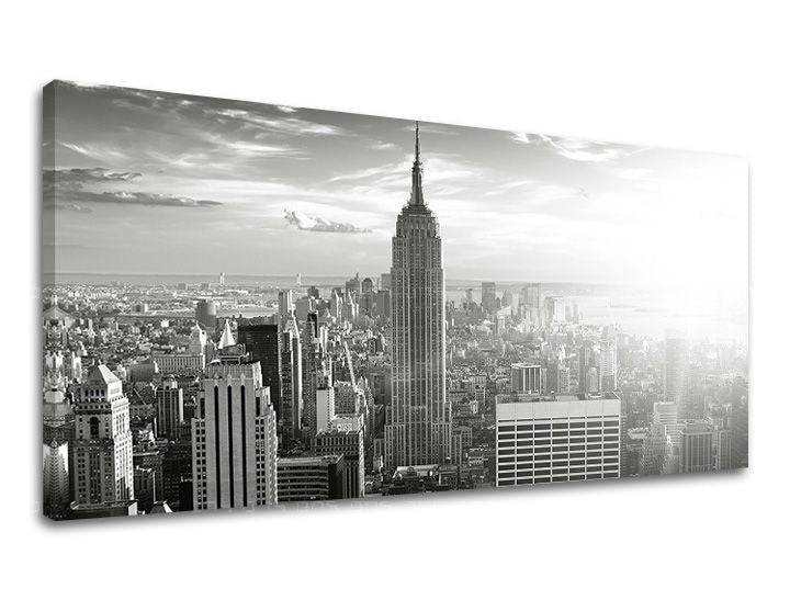 Černobílý tisk na plátně zachycuje ikonické panorama New Yorku s dominantní budovou Empire State Building, s viditelným dřevěným rámem Papilora.